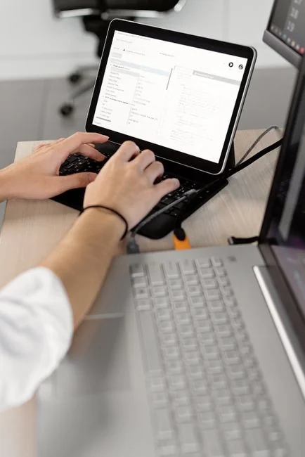 A modern computer screen displaying web design work, showcasing creative visuals in a workspace.